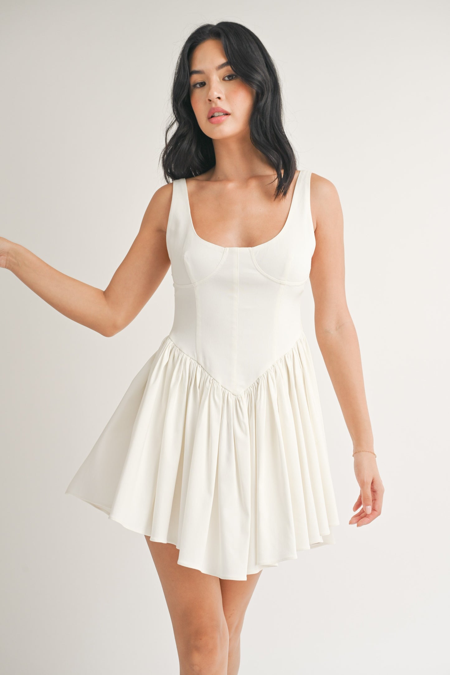 SLEEVELESS PLEATED FLARED MINI DRESS