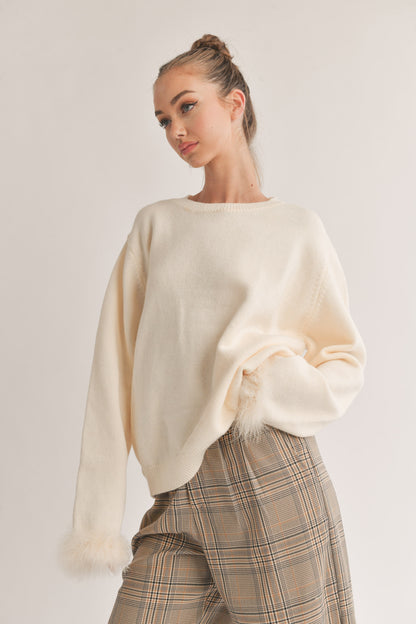 KNIT SWEATER TOP WITH FEATHER CUFFS
